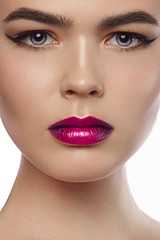 Naklejka premium sensual glamour portrait of beautiful woman model lady with fresh daily makeup with marsala lips color and clean healthy skin face. Eyeliner and thick eyebrows