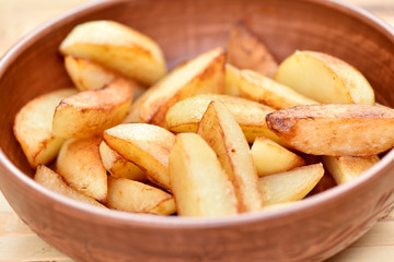 Fried potatoes in a plate. Junk food. Golden fries.