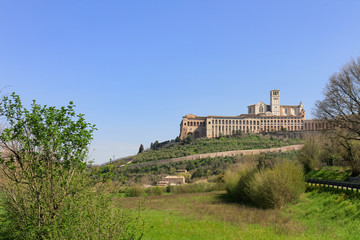 Fototapeta na wymiar The Basilica of Saint Francis of Assisi as seen from the valley below