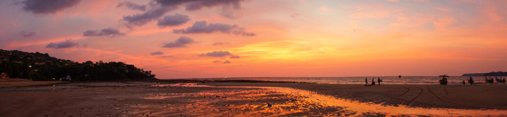 Fototapeta premium panorma - beautiful orange purple sunrise at beach shore of thailand