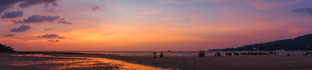 Naklejka na ściany i meble panorma - beautiful orange purple sunrise at beach shore of thailand
