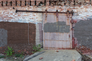 Metal industrial door on rail