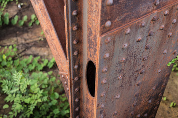 Metal beam with large rivets