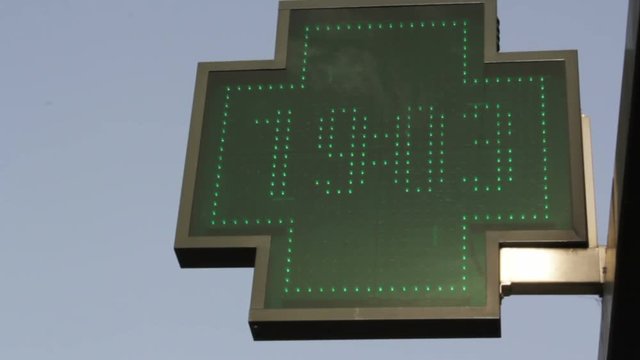 Pharmacy sign marks the temperature in degrees Celsius . 38 &deg;C (100,4 Fahrenheit) at 7p.m. on one of the hottest days in Europe.