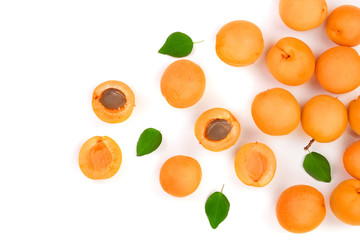 Apricot fruits with leaves isolated on white background with copy space for your text. Top view. Flat lay pattern