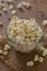 bowl of popcorn on wooden surface
