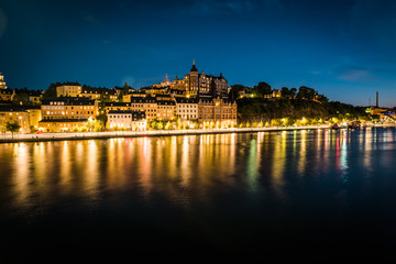 Fototapeta na wymiar Panoramic view of Old Town in Sweden - Stockholm (Gamla Stan) in a summer night. Reflection