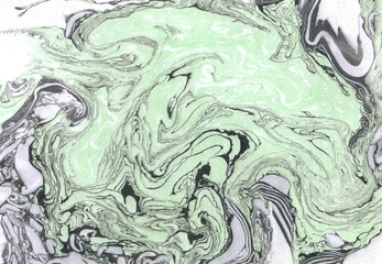 Black, white and green ink marble texture.