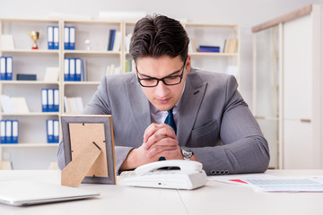 Businessman looking at the picture frame