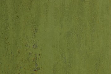 green metallic texture of a piece of an old wall of a fence