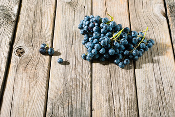 red grapes on old weathered wooden table