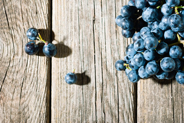 red grapes on old weathered wooden table