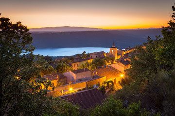 View of Aiguines village with charming chateau and church overlooking Lac de Sainte Croix Lake, Var...