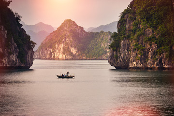 Halong bay boats,Sunset at Ha Long Bay scenic view , Hanoi, Vietnam