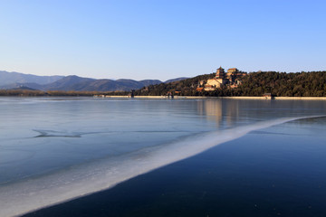 Tower of Buddhist incense and frozen Kunming lake