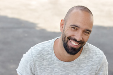 Portrait of a spanish man with snapback hat looking camera.