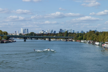 Water skiing on the Seine between Saint-Cloud and Boulogne Billancourt with La Défense in the background 01