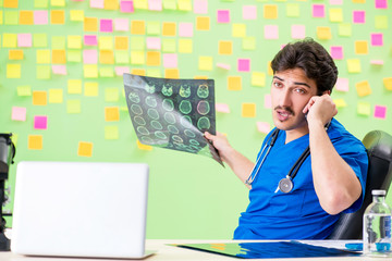 Young doctor with many reminders and urgent work