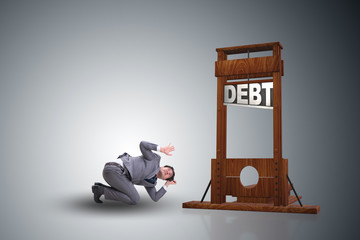 Businessman in heavy debt business concept