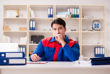 Worker in uniform working on project