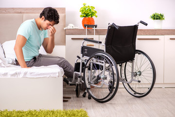 Young handsome disabled man recovering at home 