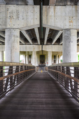 pedestrian bridge under highway in urban area