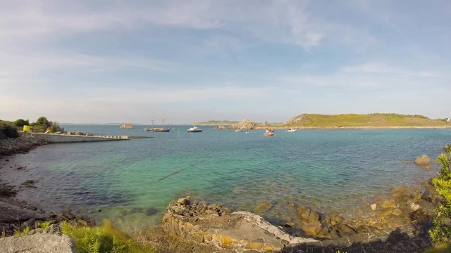 Peaceful time lapse of St Agnus quay and Gugh island, Isles of Scilly, Cornwall, UK.