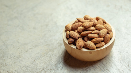 Almond on a gray cement background.