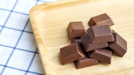 Chocolate on a wooden plate.