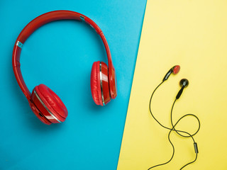red ear sound with Earphones on color background