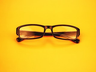 eye glasses on yellow background