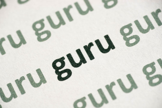 word guru printed on paper macro