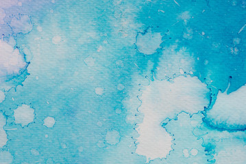 blue watercolor ink painted on paper background texture