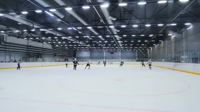 strong hockey team trains on modern arena before match