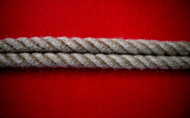 Rope on colorful red background