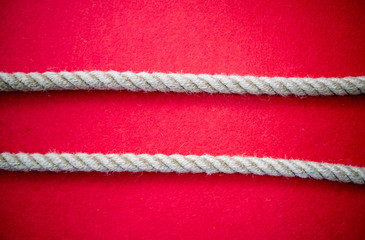 Rope on colorful red background