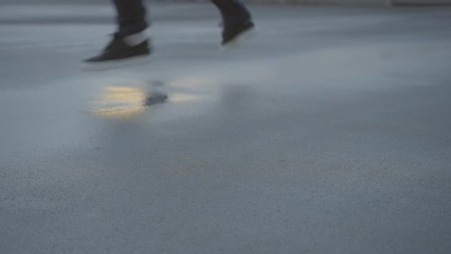 Hip Hop dance moves on a wet concrete surface in sunset. 
