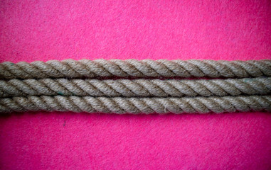 Rope on colorful pink background