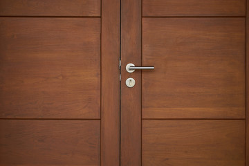 old wood door close with silver handle
