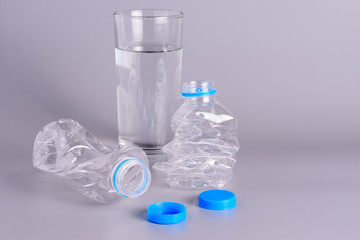 The empty bottles are crushed and flattened..