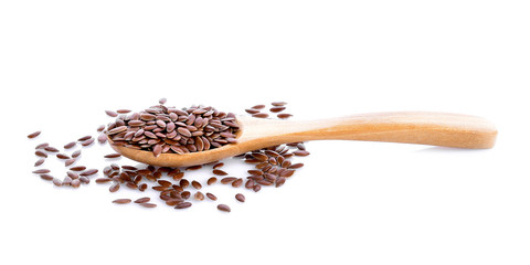 Flax seeds in wood on white background