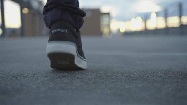 Urban dancer on a roof top environment, Close up feet