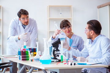 Team of chemists working in the lab