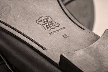 Embossed international stamp genuine leather on the sole of shoes.
