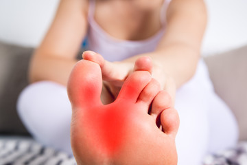 Woman's leg hurts, pain in the foot, massage of female feet