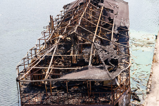 Burned ship in the water