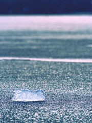 Broken floes and  iceberg. A large ice piece on freshwater ice that has broken off - obrazy, fototapety, plakaty