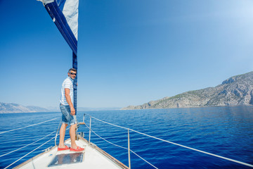 Fototapeta na wymiar Man resting On Yacht in Greece