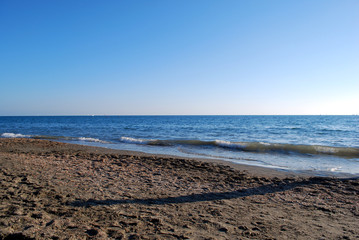 Sunset beach during hot summer in italy