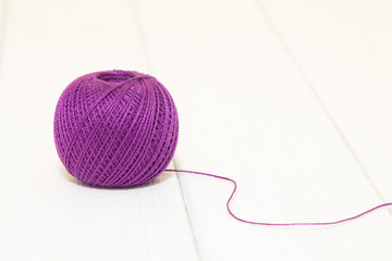 Purple thread for knitting in a roll